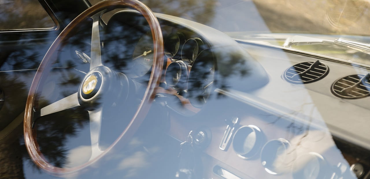  Vintage car dashboard viewed through window